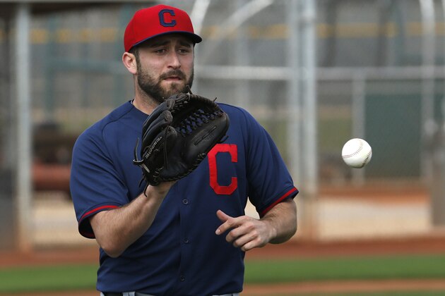 Cleveland Indians' T.J. House catches a ball during a spring training baseball workout Sunday, Feb. 22, 2015, in Goodyear, Ariz. (AP Photo/John Locher)