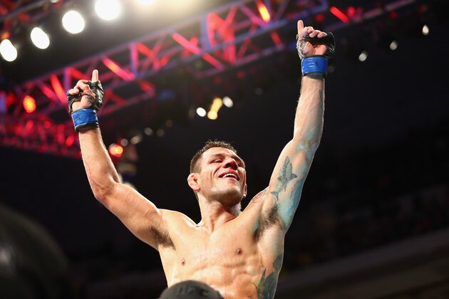 DALLAS, TX - MARCH 14:  Rafael dos Anjos celebrates his win against Anthony Pettis in the Lightweight Title bout during the UFC 185 event at American Airlines Center on March 14, 2015 in Dallas, Texas.  (Photo by Ronald Martinez/Getty Images)