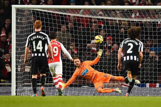 LONDON, ENGLAND - DECEMBER 13:  Santi Cazorla of Arsenal scores from the penalty spot past Jak Alnwick of Newcastle United for his team's fourth goal during the Barclays Premier League match between Arsenal and Newcastle United at Emirates Stadium on December 13, 2014 in London, England.  (Photo by Mike Hewitt/Getty Images)