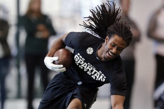 Cornerback Trae Waynes catches a ball during Michigan State NFL football pro day in East Lansing, Mich., Wednesday, March 18, 2015. (AP Photo/Paul Sancya)