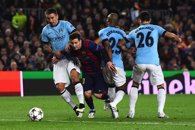 BARCELONA, SPAIN - MARCH 18: Lionel Messi of Barcelona breaks past Aleksandar Kolarov, Fernandinho and Martin Demichelis of Manchester City during the UEFA Champions League Round of 16 second leg match between Barcelona and Manchester City at Camp Nou on March 18, 2015 in Barcelona, Spain.  (Photo by David Ramos/Getty Images)