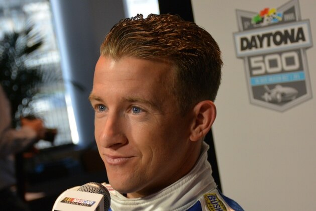 A.J. Allmendinger listens to a media question before the season in Daytona