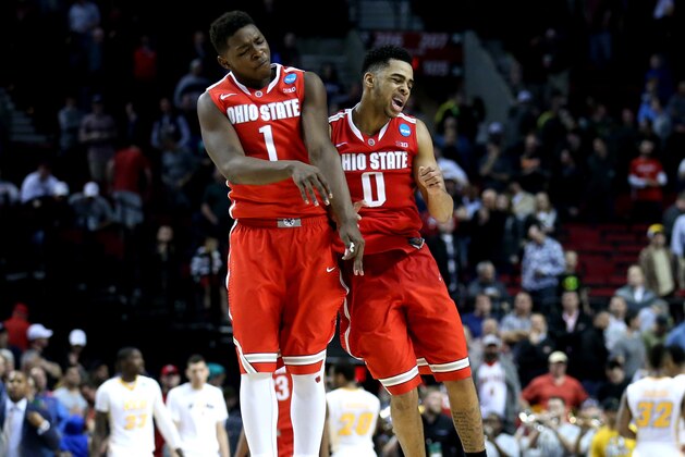 PORTLAND, OR - MARCH 19: Jae'Sean Tate #1 of the Ohio State Buckeyes and D'Angelo Russell #0 of the Ohio State Buckeyes celebrate after defeating the Virginia Commonwealth Rams in overtime, 75-72, during the second round of the 2015 NCAA Men's Basketball Tournament at Moda Center on March 19, 2015 in Portland, Oregon.  (Photo by Stephen Dunn/Getty Images)