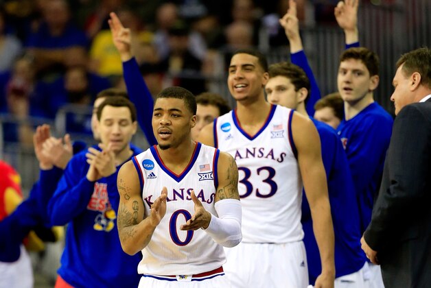 OMAHA, NE - MARCH 20: Frank Mason III #0 of the Kansas Jayhawks reacts from the bench after a basket against the New Mexico State Aggies during the second round of the 2015 NCAA Men's Basketball Tournament at the CenturyLink Center on March 20, 2015 in Omaha, Nebraska.  (Photo by Jamie Squire/Getty Images)