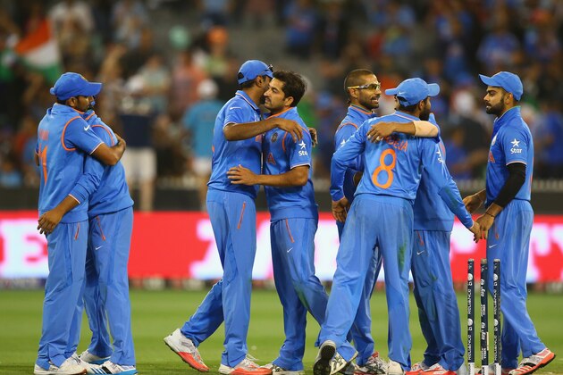 MELBOURNE, AUSTRALIA - MARCH 19:  Players from India celebrate, after India defeated Bangladesh at the 2015 ICC Cricket World Cup match between India and Bangldesh at Melbourne Cricket Ground on March 19, 2015 in Melbourne, Australia.  (Photo by Robert Cianflone/Getty Images)