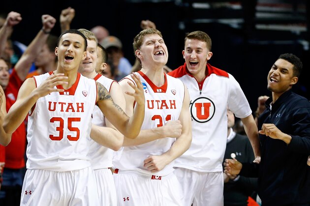 PORTLAND, OR - MARCH 19: Kyle Kuzma #35 and Dallin Bachynski #31 of the Utah Utes react with teammates late in the game against the Stephen F. Austin Lumberjacks during the second round of the 2015 NCAA Men's Basketball Tournament at Moda Center on March 19, 2015 in Portland, Oregon.  (Photo by Jonathan Ferrey/Getty Images)