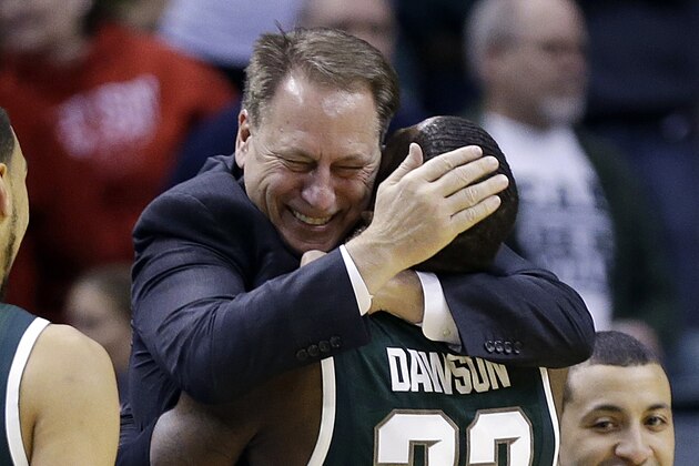 Michigan State guard/forward Branden Dawson (22) hugs head coach Tom Izzo as he walks to the bench in the second half of an NCAA college basketball game against Michigan in the championship of the Big Ten Conference tournament on Sunday, March 16, 2014, in Indianapolis. Michigan State won 69-55. (AP Photo/Michael Conroy)