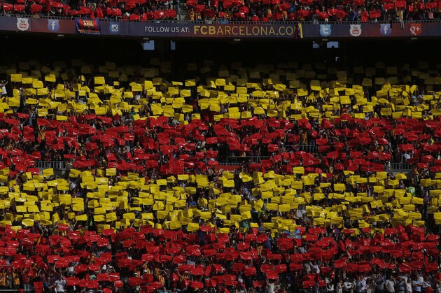 Barcelona fans wait for the start a Spanish La Liga soccer match between FC Barcelona and Atletico Madrid at the Camp Nou stadium in Barcelona, Spain, Saturday, May 17, 2014. (AP Photo/Andres Kudacki)