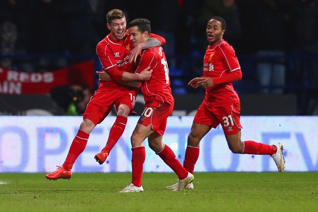 BOLTON, ENGLAND - FEBRUARY 04:  Philippe Coutinho of Liverpool celebrates scoring their second goal with Alberto Moreno and Raheem Sterling (R) of Liverpool during the FA Cup Fourth round replay between Bolton Wanderers and Liverpool at Macron Stadium on February 4, 2015 in Bolton, England.  (Photo by Alex Livesey/Getty Images)
