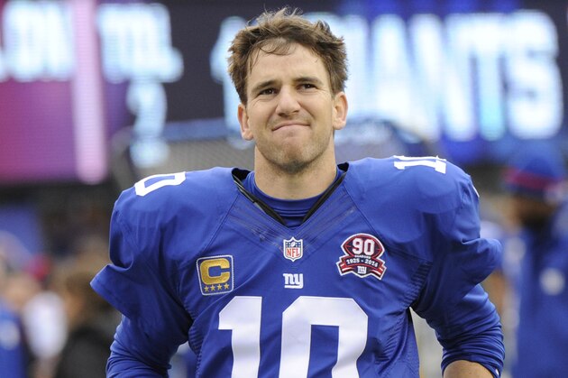 New York Giants quarterback Eli Manning runs off the field at the end of the first half of an NFL football game against the Philadelphia Eagles Sunday, Dec. 28, 2014, in East Rutherford, N.J. (AP Photo/Bill Kostroun)