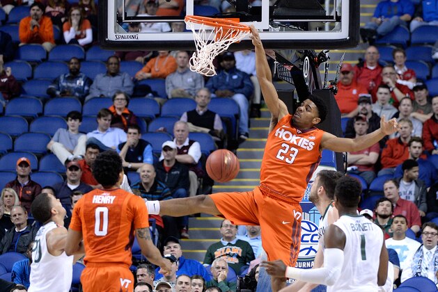 GREENSBORO, NC - MARCH 11:  Jalen Hudson #23 of the Virginia Tech Hokies dunks over Ivan Cruz Uceda #33 of the Miami Hurricanes during a second round game of the ACC basketball tournament at Greensboro Coliseum on March 11, 2015 in Greensboro, North Carolina.  (Photo by Grant Halverson/Getty Images)