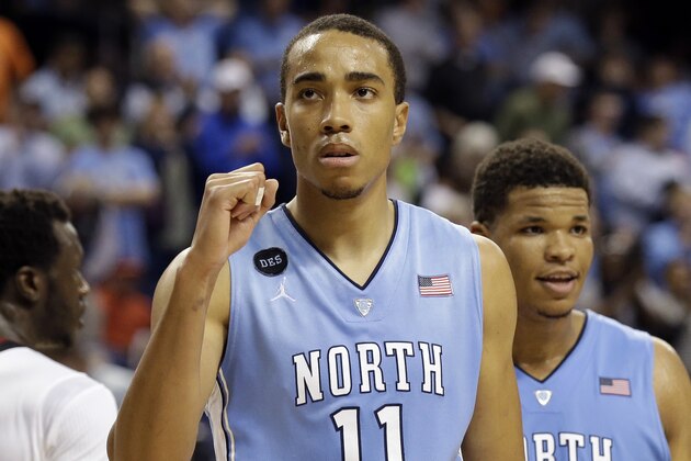 North Carolina's Brice Johnson (11) celebrates late in the second half of an NCAA college basketball game against Louisville in the quarterfinals of the Atlantic Coast Conference tournament in Greensboro, N.C., Thursday, March 12, 2015. North Carolina won 70-60. (AP Photo/Gerry Broome)