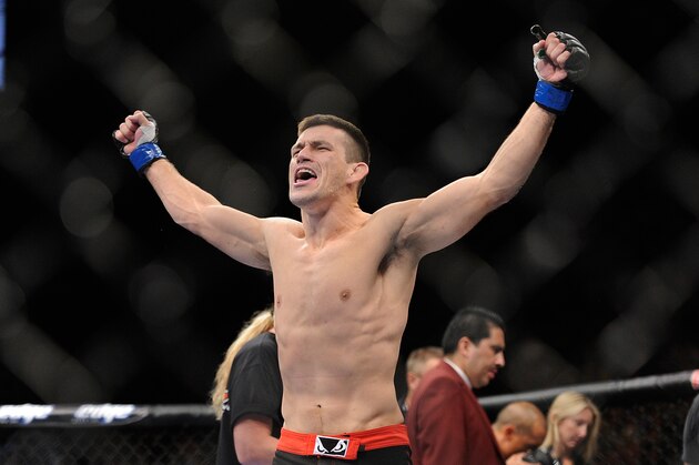 Demian Maia celebrates after knocking down Dong Hyun Kim during the first round their UFC 148 welterweight fight at the MGM Grand Garden Arena, Saturday, July 7, 2012, in Las Vegas. Maia won the bout by TKO. (AP Photo/David Becker)