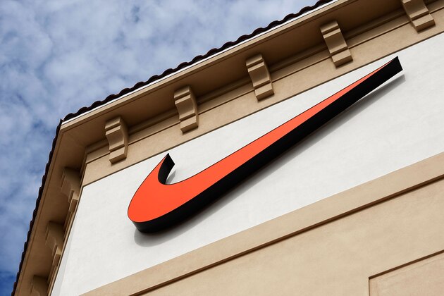 ORLANDO, FL - DECEMBER 12:  The  'Swoosh' logo is seen on a Nike factory store on December 12, 2009 in Orlando, Florida. Tiger Woods announced that he will take an indefinite break from professional golf to concentrate on repairing family relations after admitting to infidelity in his marriage. The company issued a statement that 'Woods and his family have Nike's full support.' (Photo by Getty Images)