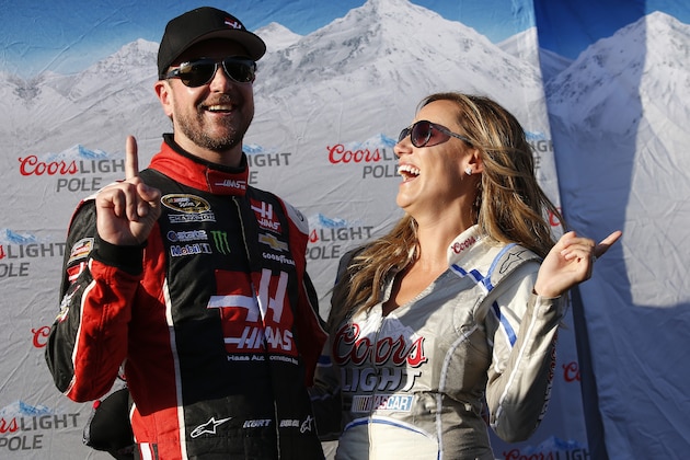 FONTANA, CA - MARCH 20:  Kurt Busch, driver of the #41 Haas Automation Chevrolet, poses for a photo with Miss Coors Light Rachel Rupert after winning the pole during qualifying for the NASCAR Sprint Cup Series Auto Club 400 at Auto Club Speedway on March 20, 2015 in Fontana, California.  (Photo by Doug Pensinger/Getty Images)
