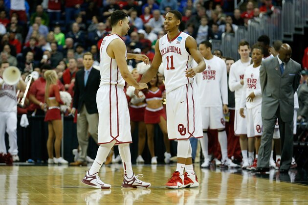 COLUMBUS, OH - MARCH 20: Frank Booker #1 (L) and Isaiah Cousins #11 of the Oklahoma Sooners celebrate following the Sooners 69-60 win over the Albany Great Danes during the second round of the 2015 NCAA Men's Basketball Tournament at Nationwide Arena on March 20, 2015 in Columbus, Ohio.  (Photo by Kirk Irwin/Getty Images)