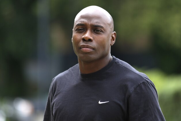 Philadelphia Eagles' Felix Jones arrives at NFL football training camp in Philadelphia, Thursday, July 25, 2013. (AP Photo/Matt Rourke)