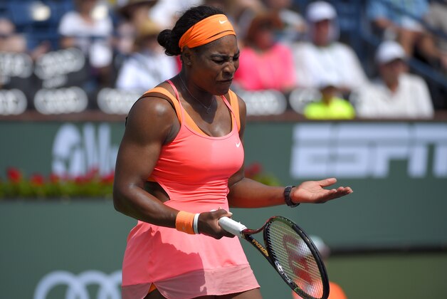Serena Williams reacts to losing a point to Sloane Stephens during their match at the BNP Paribas Open tennis tournament, Tuesday, March 17, 2015 in Indian Wells, Calif. (AP Photo/Mark J. Terrill)