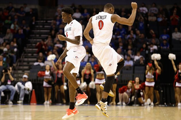 CHARLOTTE, NC - MARCH 20:  Teammates Skylar Spencer #0 and Dwayne Polee II #5 of the San Diego State Aztecs react against the St. John's Red Storm during the second round of the 2015 NCAA Men's Basketball Tournament at Time Warner Cable Arena on March 20, 2015 in Charlotte, North Carolina.  (Photo by Bob Leverone/Getty Images)