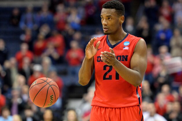 COLUMBUS, OH - MARCH 20: Dyshawn Pierre #21 of the Dayton Flyers celebrates during the closing moments of the Flyers 66-53 win over the Providence Friars during the second round of the 2015 NCAA Men's Basketball Tournament at Nationwide Arena on March 20, 2015 in Columbus, Ohio.  (Photo by Jamie Sabau/Getty Images)