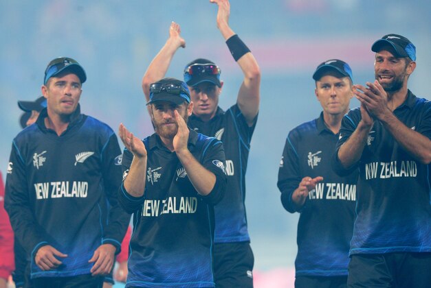 Members of the New Zealand team leave the field after defeating the West Indies by 143 runs during their Cricket World Cup quarterfinal match in Wellington, New Zealand, Saturday, March 21, 2015. (AP Photo/Ross Setford)