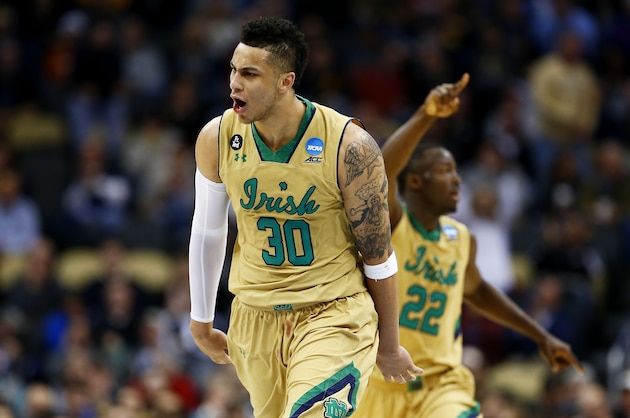 PITTSBURGH, PA - MARCH 19:  Zach Auguste #30 of the Notre Dame Fighting Irish celebrates a dunk in the second half against the Northeastern Huskies during the second round of the 2015 NCAA Men's Basketball Tournament at Consol Energy Center on March 19, 2015 in Pittsburgh, Pennsylvania.  (Photo by Jared Wickerham/Getty Images)