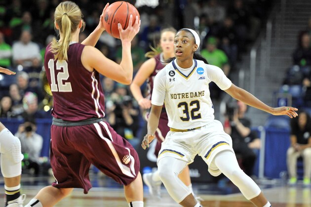Montana guard Kellie Rubel (11) heads up court as Notre Dame guard Jewell Loyd (32) defends in the first half of an NCAA tournament college basketball first round game Friday, March 20, 2015, in South Bend, Ind. (AP Photo/Joe Raymond)
