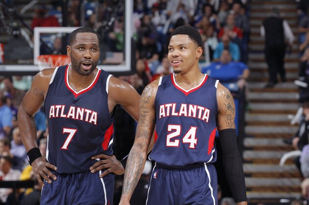 SACRAMENTO, CA - MARCH 16: Elton Brand #7 of the Atlanta Hawks speaks with teammate Kent Bazemore #24 during the game against the Sacramento Kings on March 16, 2015 at Sleep Train Arena in Sacramento, California. NOTE TO USER: User expressly acknowledges and agrees that, by downloading and or using this photograph, User is consenting to the terms and conditions of the Getty Images Agreement. Mandatory Copyright Notice: Copyright 2015 NBAE (Photo by Rocky Widner/NBAE via Getty Images)