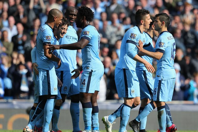 MANCHESTER, ENGLAND - MARCH 21:  David Silva of Manchester City (2L) celebrates scoring their third goal with team mates during the Barclays Premier League match between Manchester City and West Bromwich Albion at Etihad Stadium on March 21, 2015 in Manchester, England.  (Photo by Jan Kruger/Getty Images)