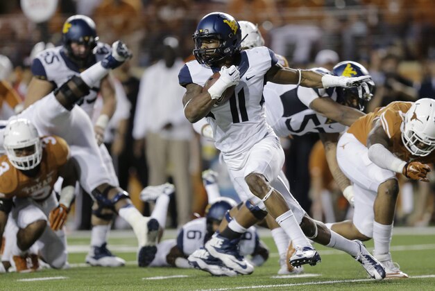 West Virginia’s Kevin White (11) runs after making a reception against Texas during the second half of an NCAA college football game, Saturday, Nov. 8, 2014, in Austin, Texas.  Texas won 33-16. (AP Photo/Eric Gay)