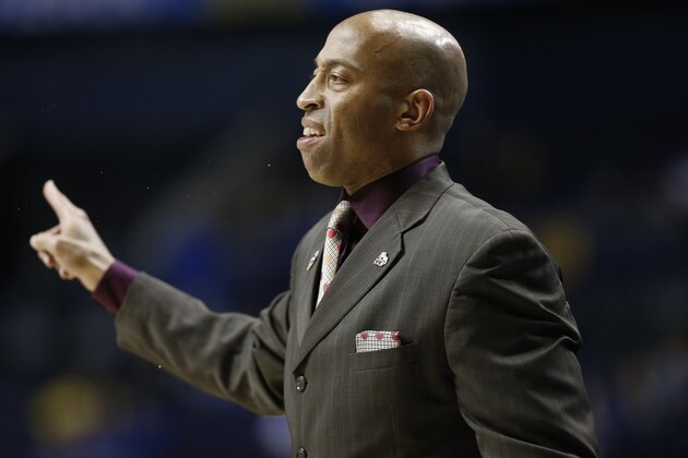 Mississippi State head coach Rick Ray speaks to players during the first half of an NCAA college basketball game in the first round of the Southeastern Conference tournament against Auburn, Wednesday, March 11, 2015, in Nashville, Tenn. (AP Photo/Steve Helber)