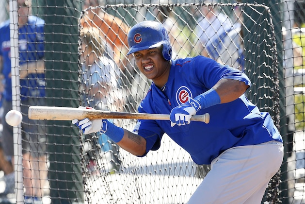 Chicago Cubs' Starlin Castro bunts during a spring training baseball practice, Wednesday, Feb. 25, 2015, in Mesa, Ariz. (AP Photo/Matt York)