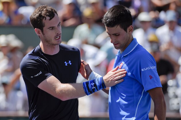 Andy Murray, of Great Britain, left, talks with Novak Djokovic, of Serbia, after their semifinal match at the BNP Paribas Open tennis tournament, Saturday, March 21, 2015, in Indian Wells, Calif. Djokovic won the match, 6-2, 6-3. (AP Photo/Mark J. Terrill)