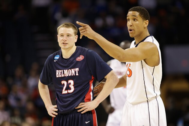 CHARLOTTE, NC - MARCH 20:  Craig Bradshaw #23 of the Belmont Bruins watches on against Anthony Gill #13 of the Virginia Cavaliers during the second round of the 2015 NCAA Men's Basketball Tournament at Time Warner Cable Arena on March 20, 2015 in Charlotte, North Carolina.  (Photo by Bob Leverone/Getty Images)