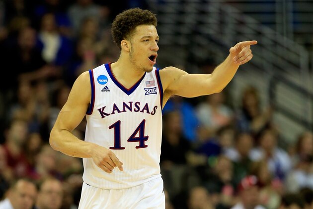 OMAHA, NE - MARCH 20:  Brannen Greene #14 of the Kansas Jayhawks reacts against the New Mexico State Aggies during the second round of the 2015 NCAA Men's Basketball Tournament at the CenturyLink Center on March 20, 2015 in Omaha, Nebraska.  (Photo by Jamie Squire/Getty Images)