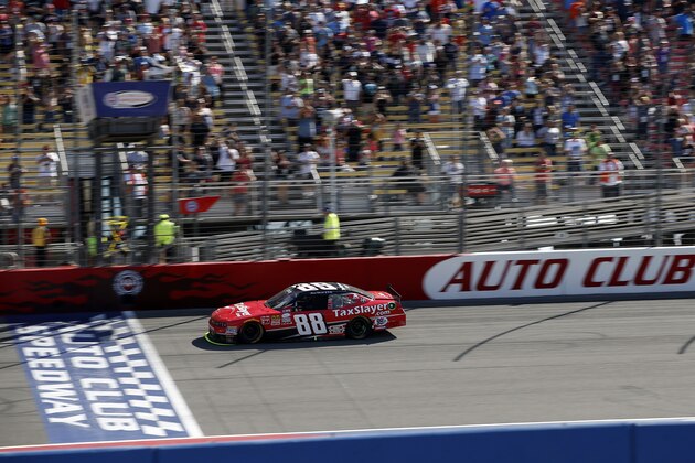 FONTANA, CA - MARCH 21:  Kevin Harvick, driver of the #88 taxslayer.com Chevrolet, crosses the finish line to win the NASCAR XFINITY Series Drive4Clots.com 300 at Auto Club Speedway on March 21, 2015 in Fontana, California.  (Photo by Doug Pensinger/Getty Images)