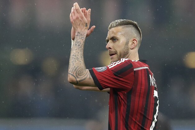 AC Milan's Jeremy Menez celebrates at the end of the Serie A soccer match between AC Milan and Cagliari at the San Siro stadium in Milan, Italy, Saturday, March 21, 2015. AC Milan won 3-1.(AP Photo/Antonio Calanni)