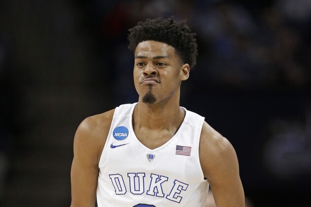 Duke's Quinn Cook (2) reacts after a basket against Robert Morris during the first half of an NCAA tournament college basketball game in the Round of 64 in Charlotte, N.C., Friday, March 20, 2015. (AP Photo/Gerald Herbert)