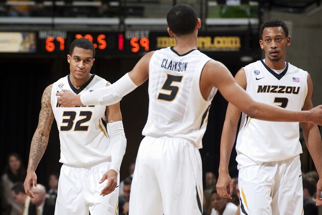 Missouri teammates Jabari Brown, left, Jordan Clarkson, center, and Johnathan Williams III meet during a timeout in the second half of an NCAA college basketball game against Long Beach State, Saturday, Jan. 4, 2014, in Columbia, Mo. Missouri won 69-59. (AP Photo/L.G. Patterson)