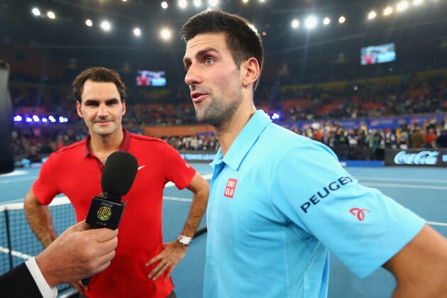 DELHI, INDIA - DECEMBER 08:  Novak Djokovic of the UAE Royals is interviewed by TV after his loss against  Roger Federer of the Indian Aces during the Coca-Cola International Premier Tennis League third leg at the Indira Gandhi Indoor Stadium December 8, 2014 in Delhi, Delhi.  (Photo by Clive Brunskill/Getty Images for IPTL 2014)