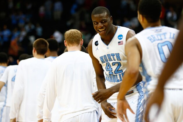 JACKSONVILLE, FL - MARCH 21: Joel James #42 of the North Carolina Tar Heels celebrates with teammates after defeating Arkansas Razorbacks during the third round of the 2015 NCAA Men's Basketball Tournament at Jacksonville Veterans Memorial Arena on March 21, 2015 in Jacksonville, Florida.  (Photo by Kevin C. Cox/Getty Images)