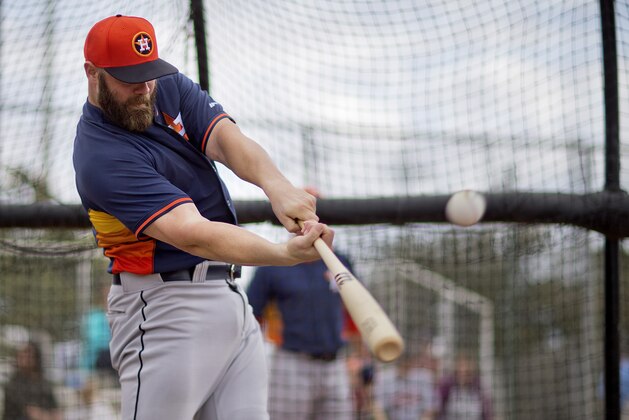 Houston Astros' Evan Gattis takes batting practice during a spring training baseball workout, Saturday, Feb. 21, 2015, in Kissimmee, Fla. (AP Photo/David Goldman)