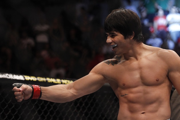 Erick Silva, from Brazil, celebrates after his welterweight mixed martial arts bout against Carlo Prater, also from Brazil, at the Ultimate Fighting Championship (UFC) 142 in Rio de Janeiro, Brazil, Sunday, Jan.  15, 2012. Silva was later disqualified and lost the fight due to illegal punches, according to the judges. (AP Photo/Felipe Dana)