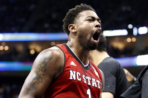 North Carolina State's Trevor Lacey (1) celebrates as he leaves the court with his team leading No. 1 seed Villanova at the end of the first half of an NCAA tournament third-round college basketball game, Saturday, March 21, 2015, in Pittsburgh. (AP Photo/Gene J. Puskar)