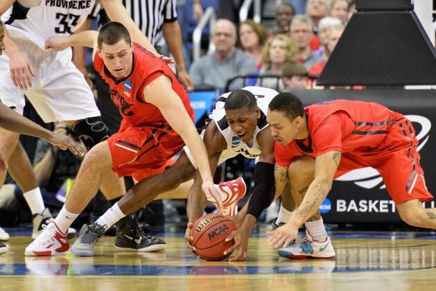 COLUMBUS, OH - MARCH 20: Bobby Wehrli #22 of the Dayton Flyers (L) and Kyle Davis #3 of the Dayton Flyers (R) go after the ball against Kris Dunn #3 of the Providence Friars in the second half during the second round of the 2015 NCAA Men's Basketball Tournament at Nationwide Arena on March 20, 2015 in Columbus, Ohio.  (Photo by Jamie Sabau/Getty Images)
