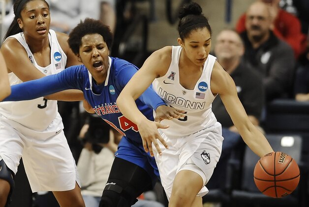 Connecticut’s Gabby Williams, right, steals the ball from St. Francis’ Jaymee Veney, center, as Connecticut’s Morgan Tuck, left, defends during the second half of a women's college basketball game in the first round of the NCAA tournament, Saturday, March 21, 2015, in Storrs, Conn. (AP Photo/Jessica Hill)