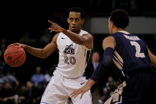 Old Dominion's Trey Freeman (20) controls the offense as Charleston Southern's Aaron Wheeler (2) defends during the first half of an NCAA college basketball game in the National Invitational Tournament, Wednesday, March 18, 2015 in Norfolk, Va.  (AP Photo/Jason Hirschfeld)