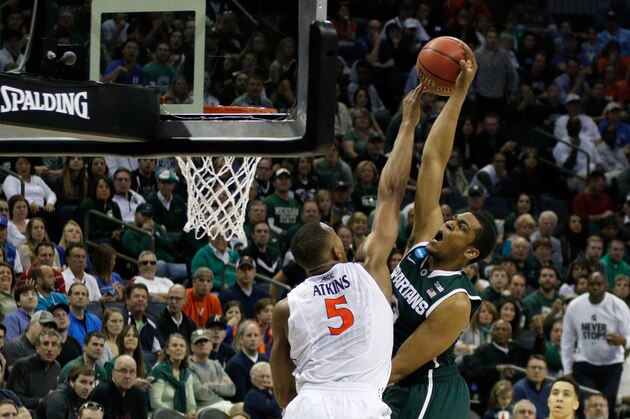 CHARLOTTE, NC - MARCH 22:  Darion Atkins #5 of the Virginia Cavaliers blocks Alvin Ellis III #3 of the Michigan State Spartans during the third round of the 2015 NCAA Men's Basketball Tournament at Time Warner Cable Arena on March 22, 2015 in Charlotte, North Carolina.  (Photo by Bob Leverone/Getty Images)