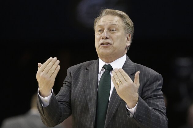 Michigan State head coach Tom Izzo directs his team against Virginia during the second half of an NCAA tournament college basketball game in the Round of 32 in Charlotte, N.C., Sunday, March 22, 2015. (AP Photo/Gerald Herbert)