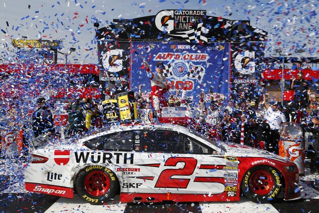 FONTANA, CA - MARCH 22:  Brad Keselowski, driver of the #2 Wurth Ford, celebrates in Victory Lane after winning the NASCAR Sprint Cup Series Auto Club 400 at Auto Club Speedway on March 22, 2015 in Fontana, California.  (Photo by Jerry Markland/Getty Images)